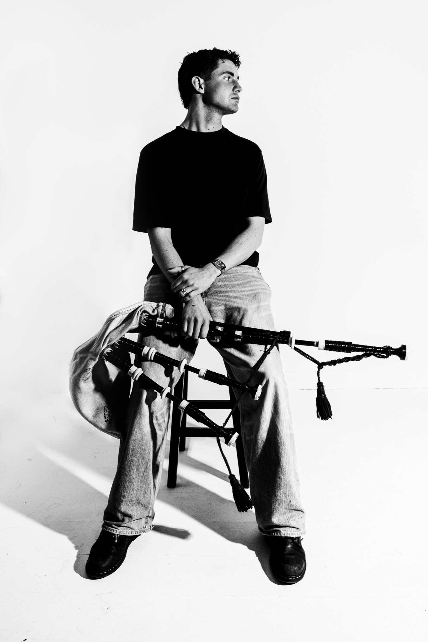 Bede Patterson seated with Highland bagpipes